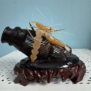 Hand carved shrimp and trap, water buffalo horn.